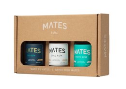 A gift box containing three bottles of Mates Experience Rum, featuring a variety of flavors. The box includes a turquoise bottle, a blue bottle, and a brown bottle, all showcasing the Mates brand.