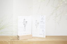 Forget-me-not flowers in a vase, illustrated cards with simple line drawings of floral elements.