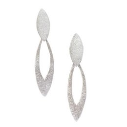 Silver statement earrings with a leaf-like design, featuring a textured, brushed metal finish.