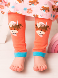  Bright orange kids' leggings with playful highland cow graphics and contrasting turquoise trim. Ideal for casual, comfortable wear.