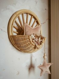Rattan hanging basket shelf with star-shaped decorations, suitable for kids' wardrobes.