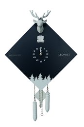 Black and white cuckoo clock with deer antlers and pine tree silhouette design. Features a traditional clock face and pendulum.