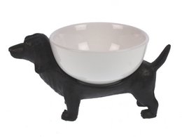 Decorative dachshund-shaped bowl made of black and white ceramic material, suitable for pet food or water.