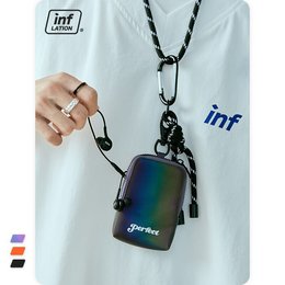 Compact, colorful shoulder bag with a unique iridescent finish and a detachable strap for versatile wear.