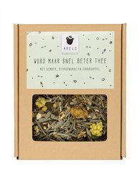 Loose leaf tea blend with dried apple, cinnamon, and other natural ingredients in a cardboard box.