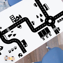 Sticky Roads play stickers discount set (black or white) - Kids Toys. The product features a variety of black and white road and traffic-themed stickers that can be used for creative play. The stickers include shapes like roads, cars, trees, and other traffic elements that can be arranged to create imaginative road scenes.