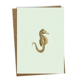 Greeting card with a gold embroidered seahorse design on a light green background. The card is suitable for various occasions.