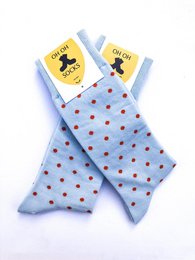 Light blue socks with red polka dots pattern.