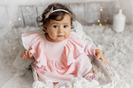 A pink cotton dress for a baby girl, available in sizes 50-98 cm.