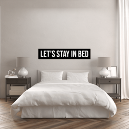 Rectangular wall art with the text "Let's stay in bed" in a modern, minimalist style. Available in two sizes: 120 x 20 cm and 160 x 30 cm.
