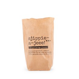 Natural crisps in a brown paper bag with the product name "Sjippie A dear!" printed on it. The crisps appear to be made from natural ingredients.