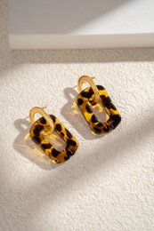  Rectangular gold-toned resin and stainless steel drop earrings with a trendy leopard print pattern.