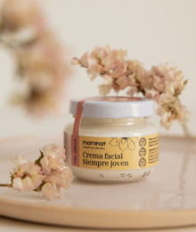 Oily forever young face cream (Anti-wrinkle) is a cream product with a natural, botanical-inspired design. The cream is packaged in a small glass jar with a white label featuring a leaf or plant illustration, indicating it contains natural ingredients. The cream appears to have a light, creamy texture suitable for facial application.