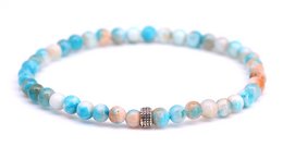 Beaded bracelet with blue, white, and brown tones. Features a mix of round and irregular shaped beads.