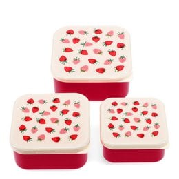 Three red and cream snack boxes with strawberry pattern, plastic material, square shape, cute fruit design.