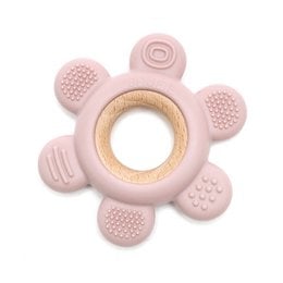 A soft and hard flower-shaped wooden and silicone teether in a baby pink color. The teether features various textures and shapes to soothe a baby's gums during the teething process.