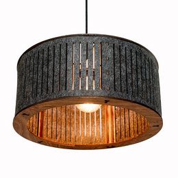Cylindrical hanging lamp with a woven black shade and warm, ambient lighting.