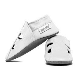 White leather summer slippers with a simple, minimalist design. Features a comfortable, flexible sole and a slip-on style for easy wear.