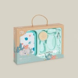A colorful kids' toiletry bag set with a comb, brush, and scissors in a mint green and white design with floral accents.