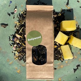 Loose leaf black tea with caramel flavor, packaged in a kraft paper bag with a Bollywood-inspired label.