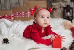 Red bodysuit with flutter sleeves for baby girl, available in sizes newborn to 18 months.