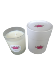  A tall, round white candle with a pink floral label, featuring the scent of orange blossom.