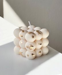 Elegant white bubble candle with a modern, minimalist design. Made of high-quality wax, this candle creates a warm, cozy ambiance in any dining space.