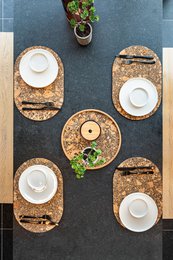  Oval cork placemat, natural material, earth tones, textured surface, 45x30 cm, heat-resistant dining accessory.