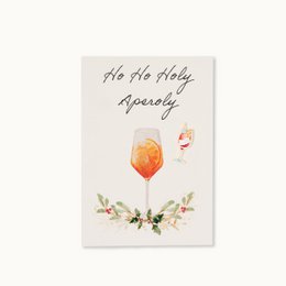 "Ho Ho Holy Aperoly Christmas card with festive cocktail, holly leaves, and holiday greeting text"