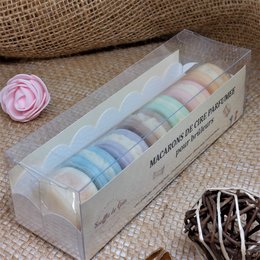 Box of 7 perfumed wax fondants in various pastel colors. The fondants are arranged in a clear display box, showcasing their delicate, round shapes and soft hues.