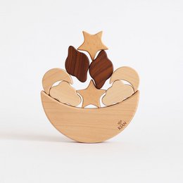  Wooden balancing moon stacking game with star-shaped pieces in a bowl-shaped base.