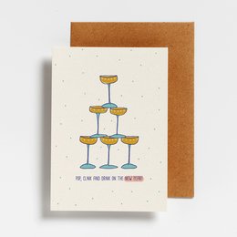 Colorful champagne flute tower with text "POP, CLINK AND DRINK ON THE NY" on a Christmas card.