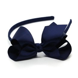 Navy blue bow headband with a large bow for girls.