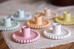  Colorful, round, and textured candle holders in various pastel shades including white, beige, pink, yellow, orange, mint, and light blue.