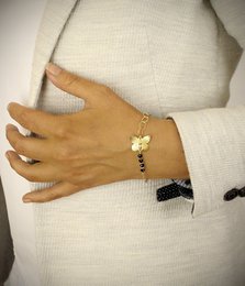 18K guldbelagt sommerfugl og Golden Shadow krystalarmbånd