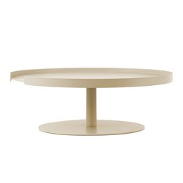 A round, tall cake stand made of a light-colored material, likely wood or ceramic, with a simple, minimalist design.