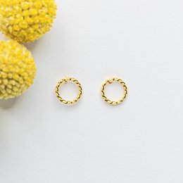 Gold-plated twisted hoop earrings with a simple, elegant design. Suitable for everyday wear.
