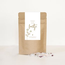 "Relaxing bath salts in a natural paper packaging, featuring a floral design and the text 'Today is your party'."