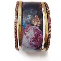 A floral cuff bracelet with a vintage-inspired design featuring pink and purple roses against a dark background. The bracelet has a gold-tone metal accent.