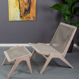 A modern, minimalist lounge chair made of white oak and beige upholstery. The chair features a clean, geometric design with a slanted backrest and a matching footrest for comfortable relaxation.