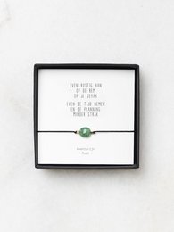 Green aventurine bracelet with inspirational poem charm, designed for rest and reflection.