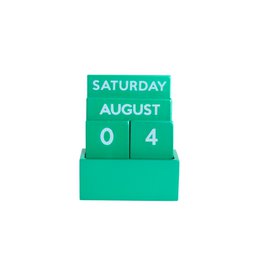 A small, green, glossy, full-color desk calendar with the date "SATURDAY AUGUST 04" displayed prominently.