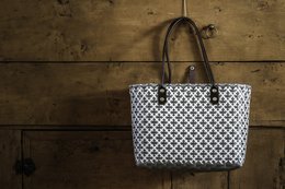 Recycled material shopping bag with geometric pattern design, suitable for beach or everyday use.