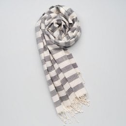 Soft, handwoven cotton scarf in grey and white striped pattern with fringed edges.