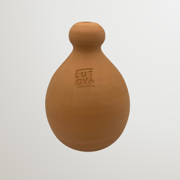  "Terracotta brown round bulbous watering bell with thumb grip, plant watering tool"