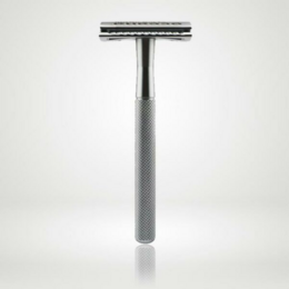 Grey metal safety razor with textured grip for a close, zero-waste shave.