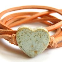 Natural leather bracelet with antique green heart