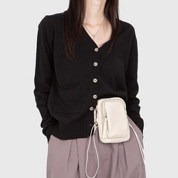 A black, button-up cardigan with a V-neck and long sleeves. The cardigan is made of a soft, comfortable material and is suitable for casual or formal wear.