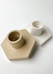 Hexagonal candle holder in snow white and reborn beige colors, made of ceramic material with a simple, minimalist design.