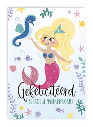 A colorful greeting card featuring a smiling mermaid with blonde hair, surrounded by sea creatures and stars. The text on the card reads "Congratulations, you have your swimming diploma!"